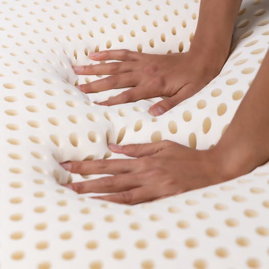 Adjustable beds and latex mattresses on the Electropedic showroom floor in Burbank