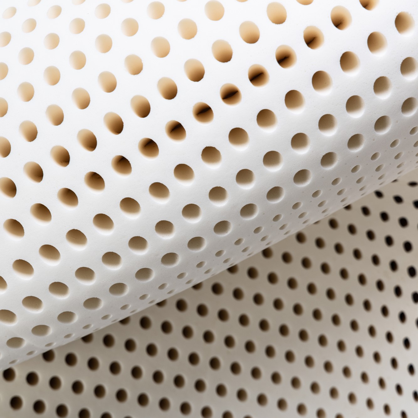 Natural latex mattress flexing on an adjustable bed